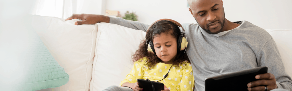 blog_banner_What Do Patients Want Out of Patient Engagement_0219 Man and child sit on couch looking at tablets