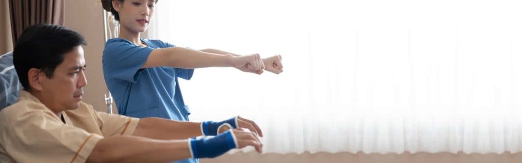 Clinical staff leads patient in exercise therapy
